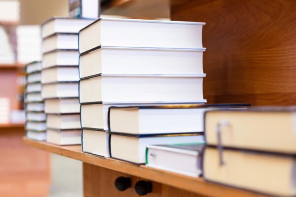 A close up of several books on a shelf